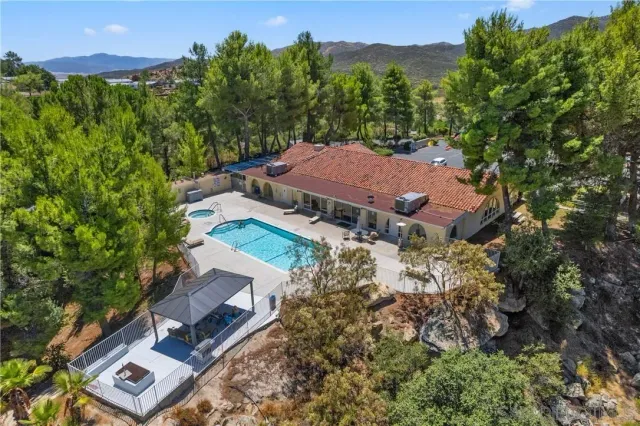 swimming pool view with a seating space
