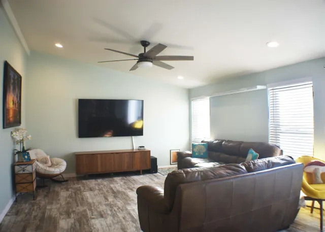 a living room with furniture and a flat screen tv
