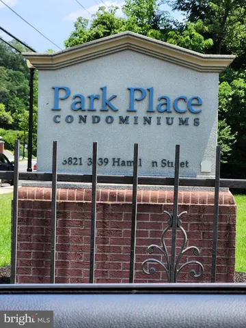 a front view of a house with parking area