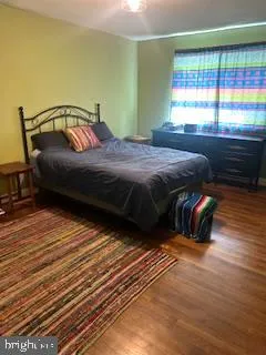 a view of a room with rack and wooden floor