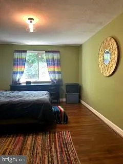 a room with pool table and windows