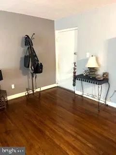 a view of a workspace with wooden floor