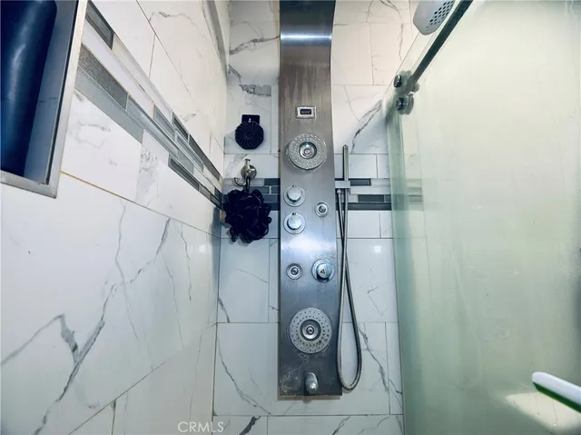 a bedroom with a bed and lamp