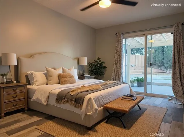 a bedroom with a bed and a lamp on the dresser