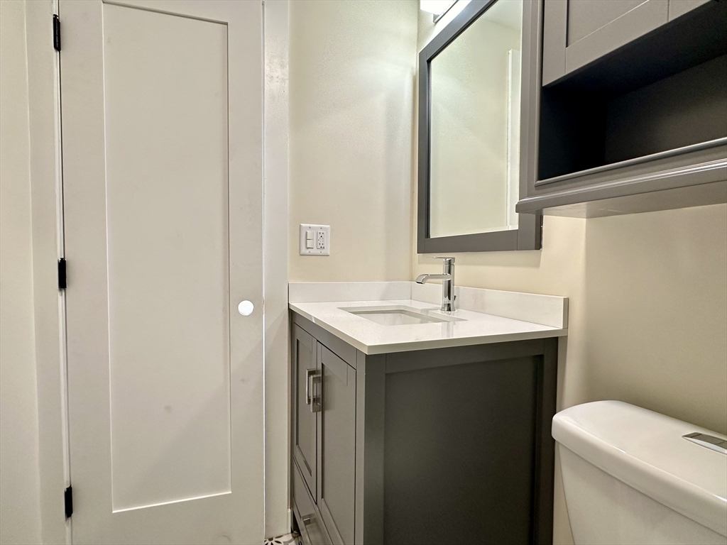 64 North Margin Street, Unit 4R Boston, MA 02113 - Photo 18 of 18 a bathroom with a sink and a toilet
