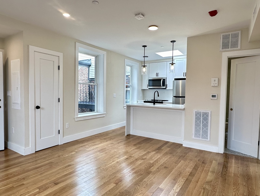 64 North Margin Street, Unit 4R Boston, MA 02113 - Photo 2 of 18 a view of kitchen with granite countertop cabinets and refrigerator
