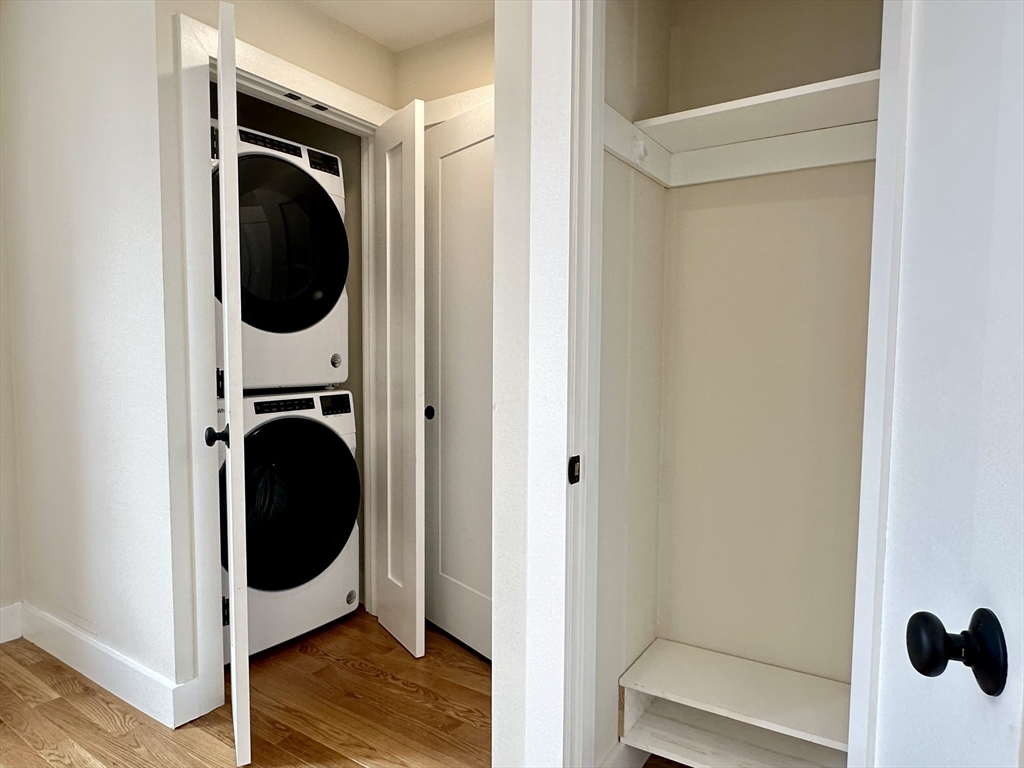 64 North Margin Street, Unit 4R Boston, MA 02113 - Photo 3 of 18 a view of a hallway with washer and dryer