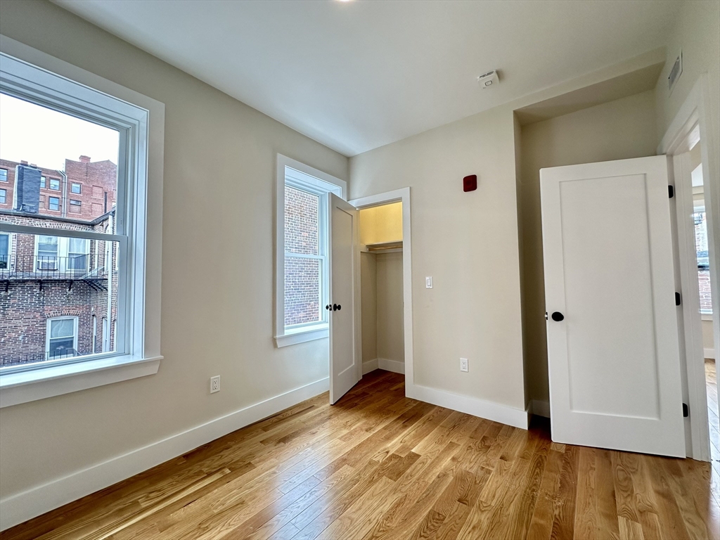 64 North Margin Street, Unit 4R Boston, MA 02113 - Photo 10 of 18 a view of empty room with wooden floor and fan