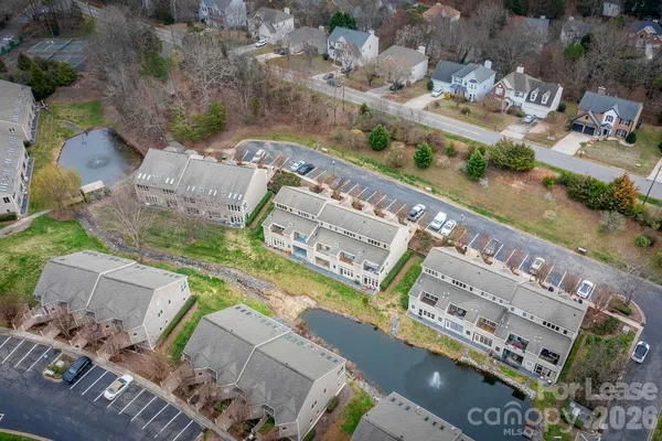an aerial view of a house with outdoor space