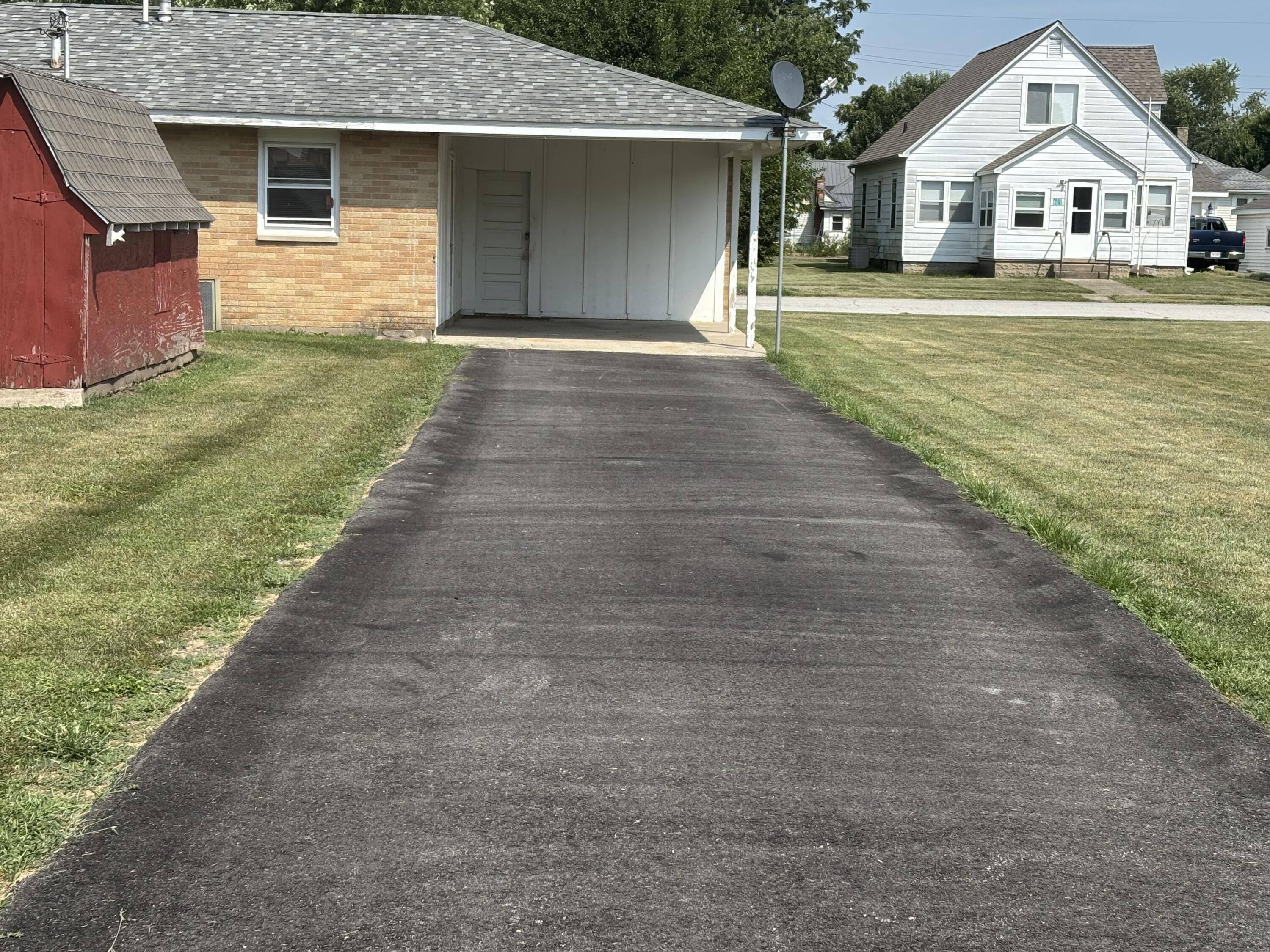 606 North Race Street Monon, IN 47959 - Photo 14 of 14 a front view of a house with a yard and garage
