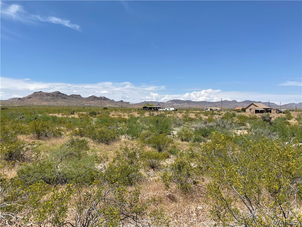 0 South Dewey Road Golden Valley, AZ 86413 - Photo 8 of 11 a view of a mountain range with lush green forest
