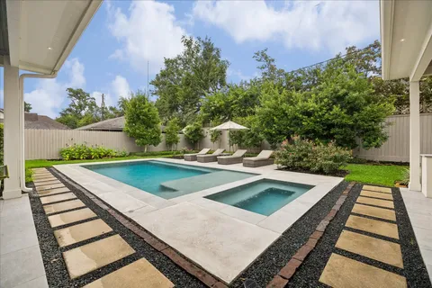 a view of a backyard with sitting area