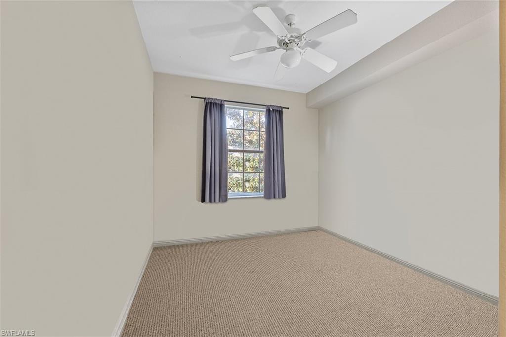 348 Dover Place, Unit C103 Naples, FL 34104 - Photo 15 of 27 an empty room with a window