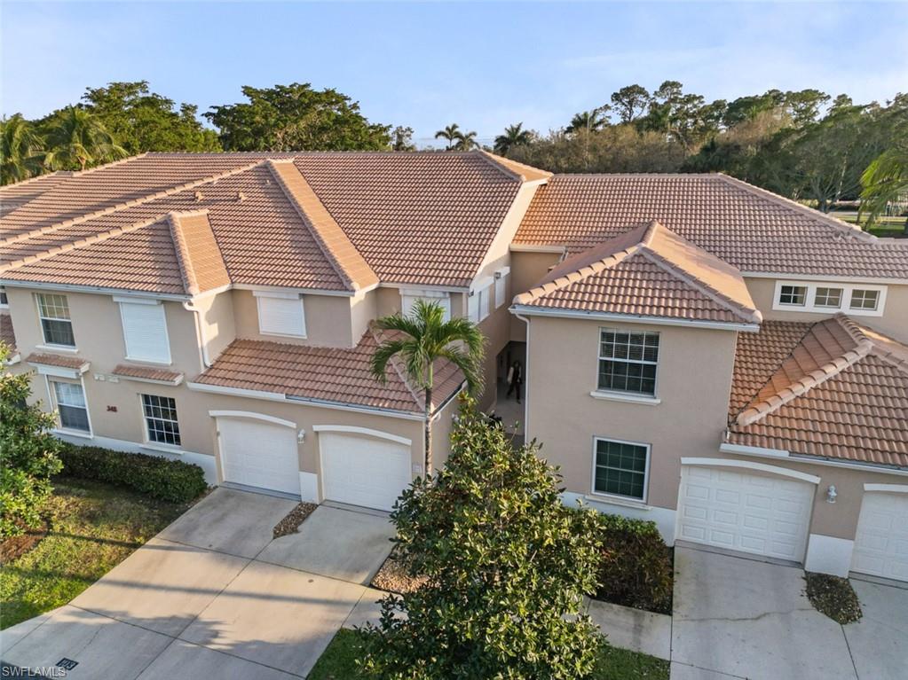 348 Dover Place, Unit C103 Naples, FL 34104 - Photo 18 of 27 a aerial view of a house
