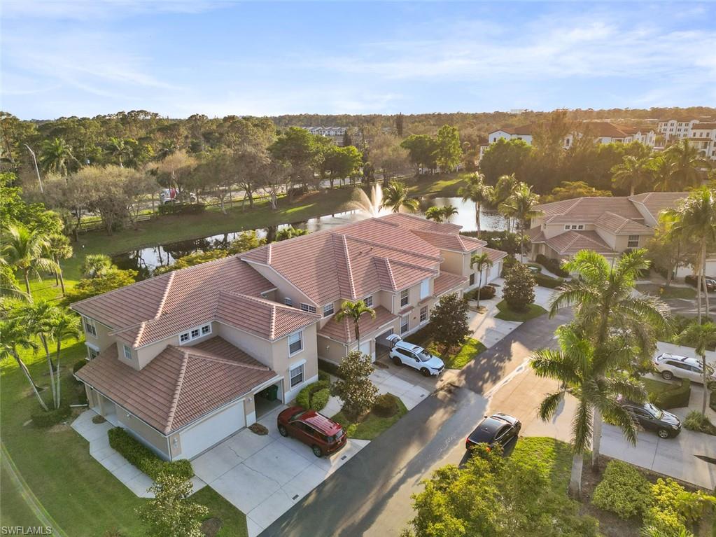 348 Dover Place, Unit C103 Naples, FL 34104 - Photo 20 of 27 an aerial view of residential houses with outdoor space