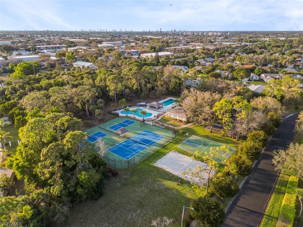 348 Dover Place, Unit C103 Naples, FL 34104 - Photo 23 of 27 an aerial view of residential houses with outdoor space