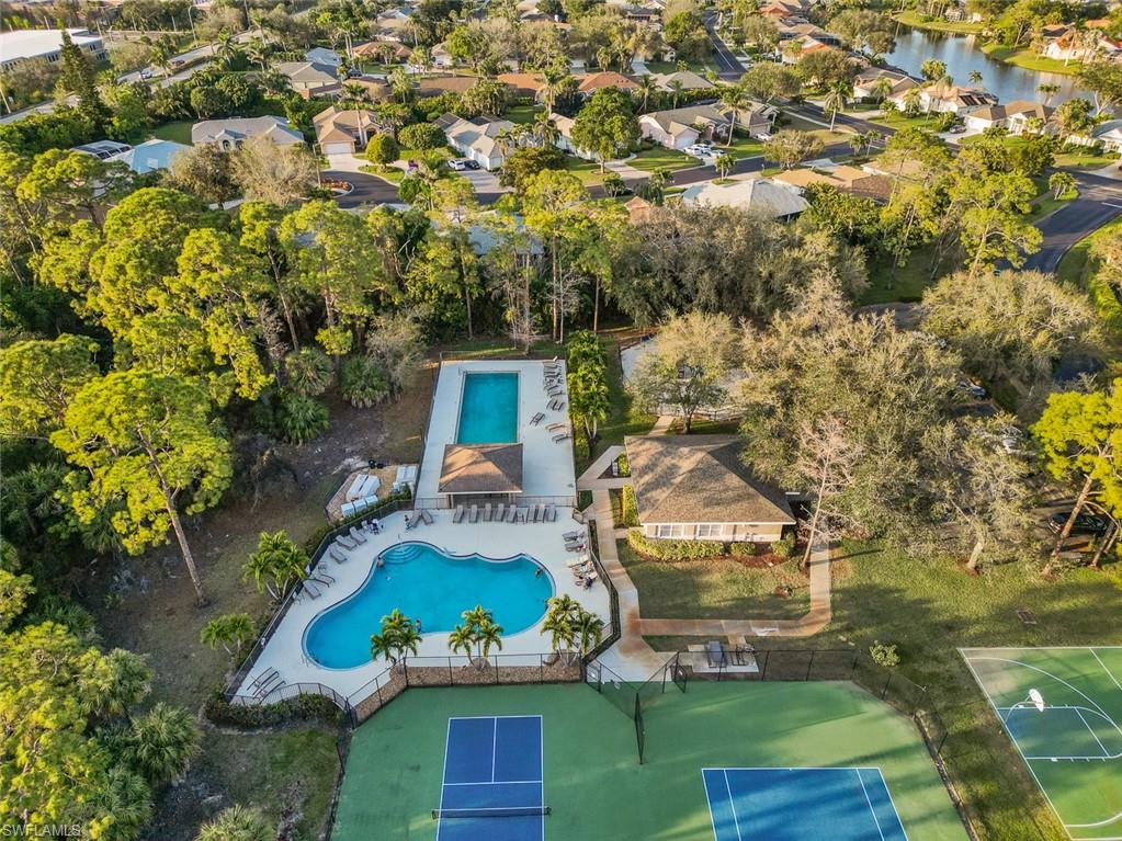348 Dover Place, Unit C103 Naples, FL 34104 - Photo 24 of 27 an aerial view of a house with garden space sitting space and swimming pool
