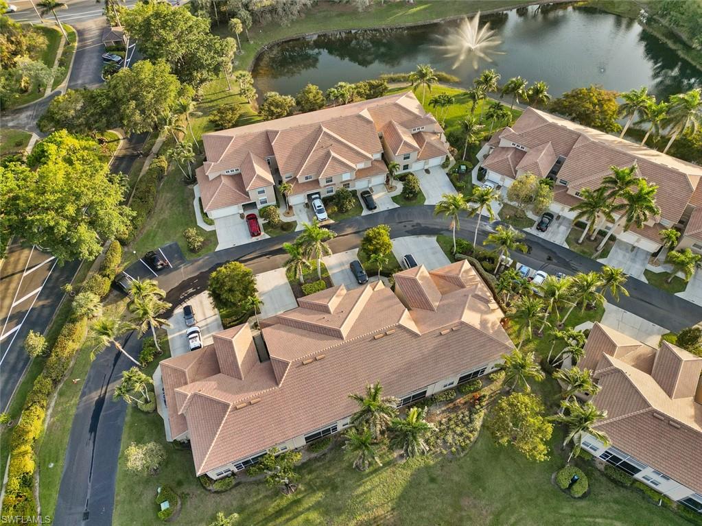 348 Dover Place, Unit C103 Naples, FL 34104 - Photo 26 of 27 an aerial view of a house with a lake view