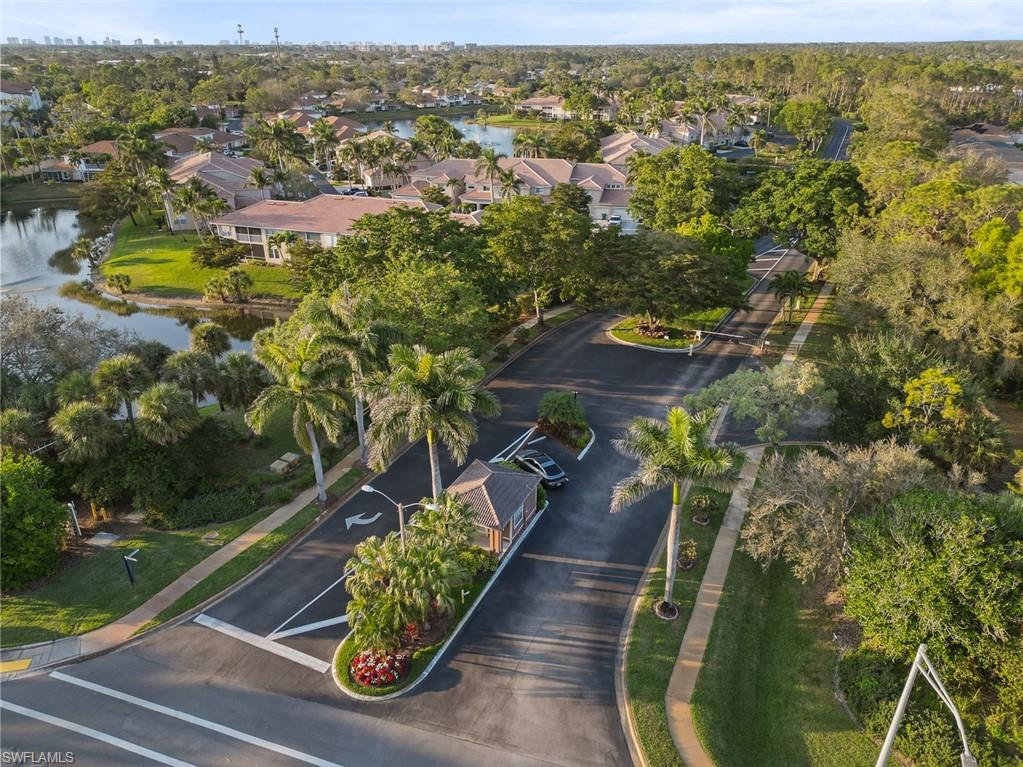 348 Dover Place, Unit C103 Naples, FL 34104 - Photo 27 of 27 an aerial view of residential houses with outdoor space