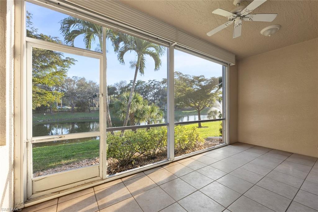 348 Dover Place, Unit C103 Naples, FL 34104 - Photo 4 of 27 a view of a porch with a floor to ceiling window