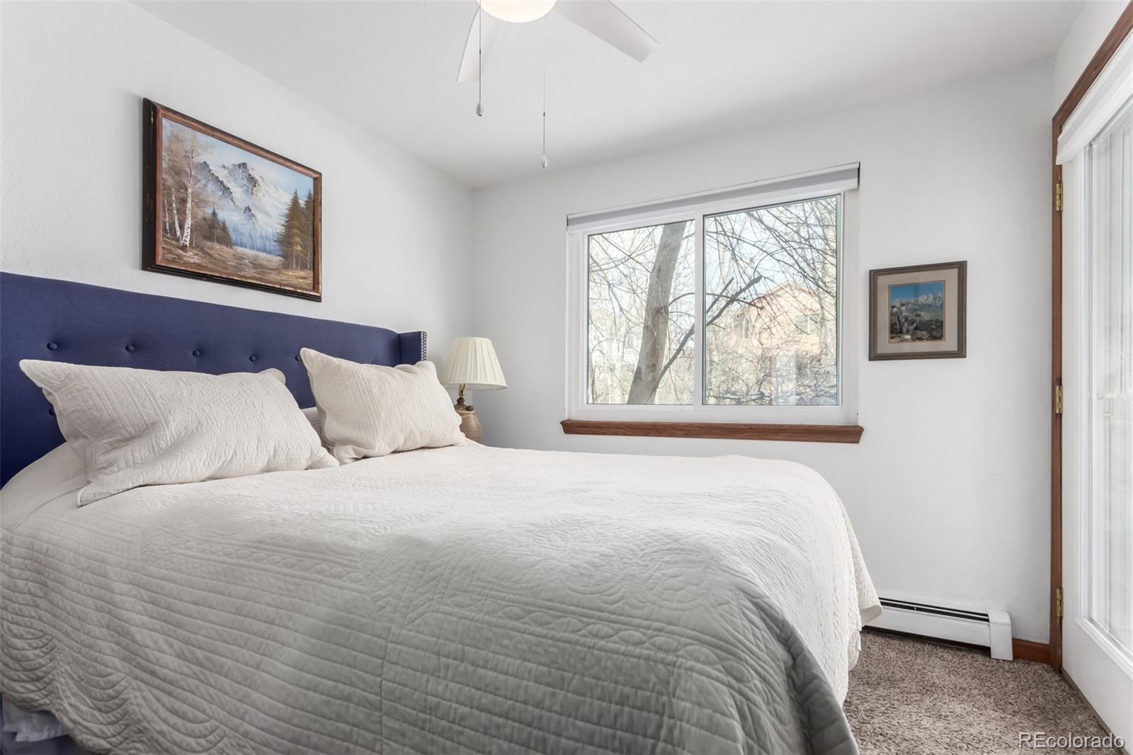 4855 Edison Avenue, Unit 112 Boulder, CO 80301 - Photo 11 of 20 a bedroom with a large bed and a window