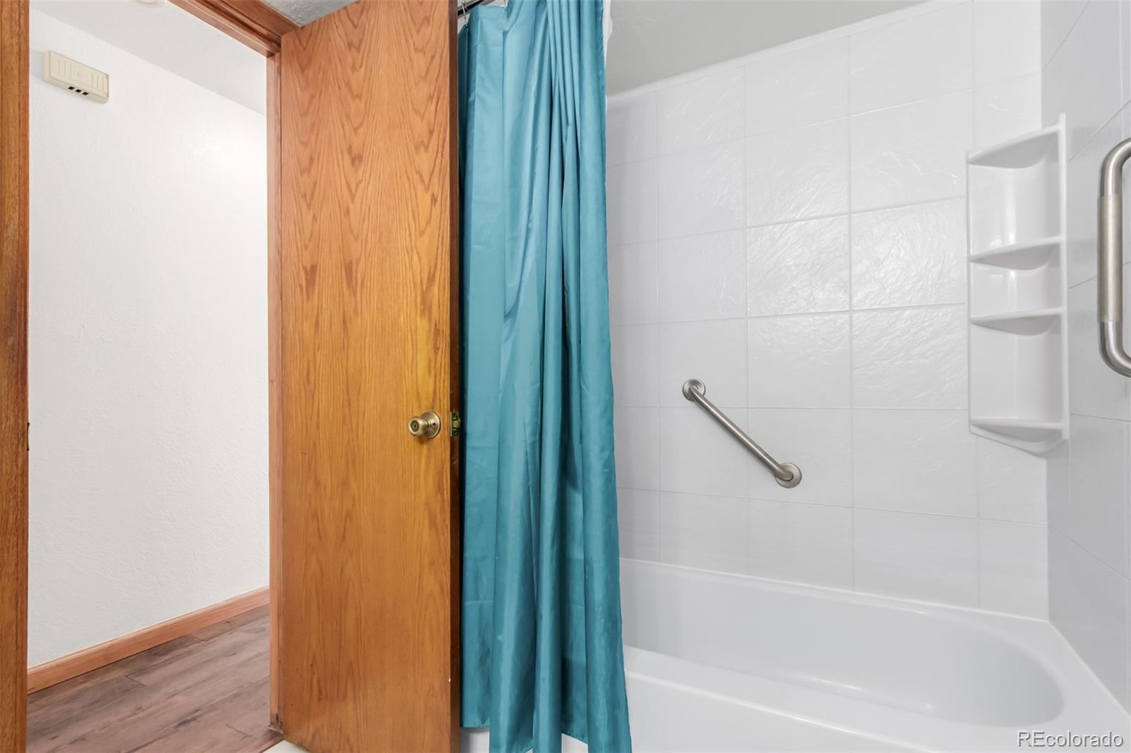4855 Edison Avenue, Unit 112 Boulder, CO 80301 - Photo 14 of 20 a bathroom with a bathtub