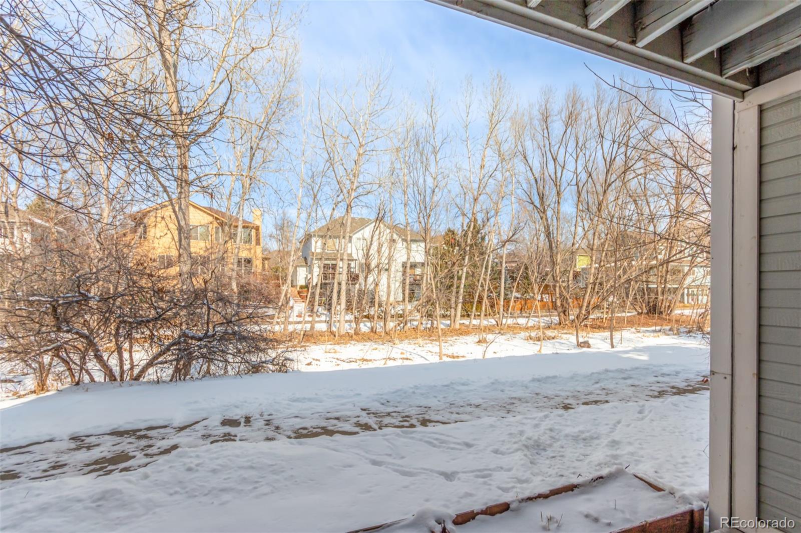 4855 Edison Avenue, Unit 112 Boulder, CO 80301 - Photo 17 of 20 a view of a yard with a snow on the road
