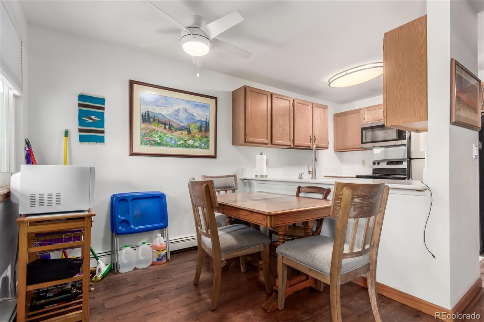 4855 Edison Avenue, Unit 112 Boulder, CO 80301 - Photo 7 of 20 a view of kitchen with cabinets and wooden floor