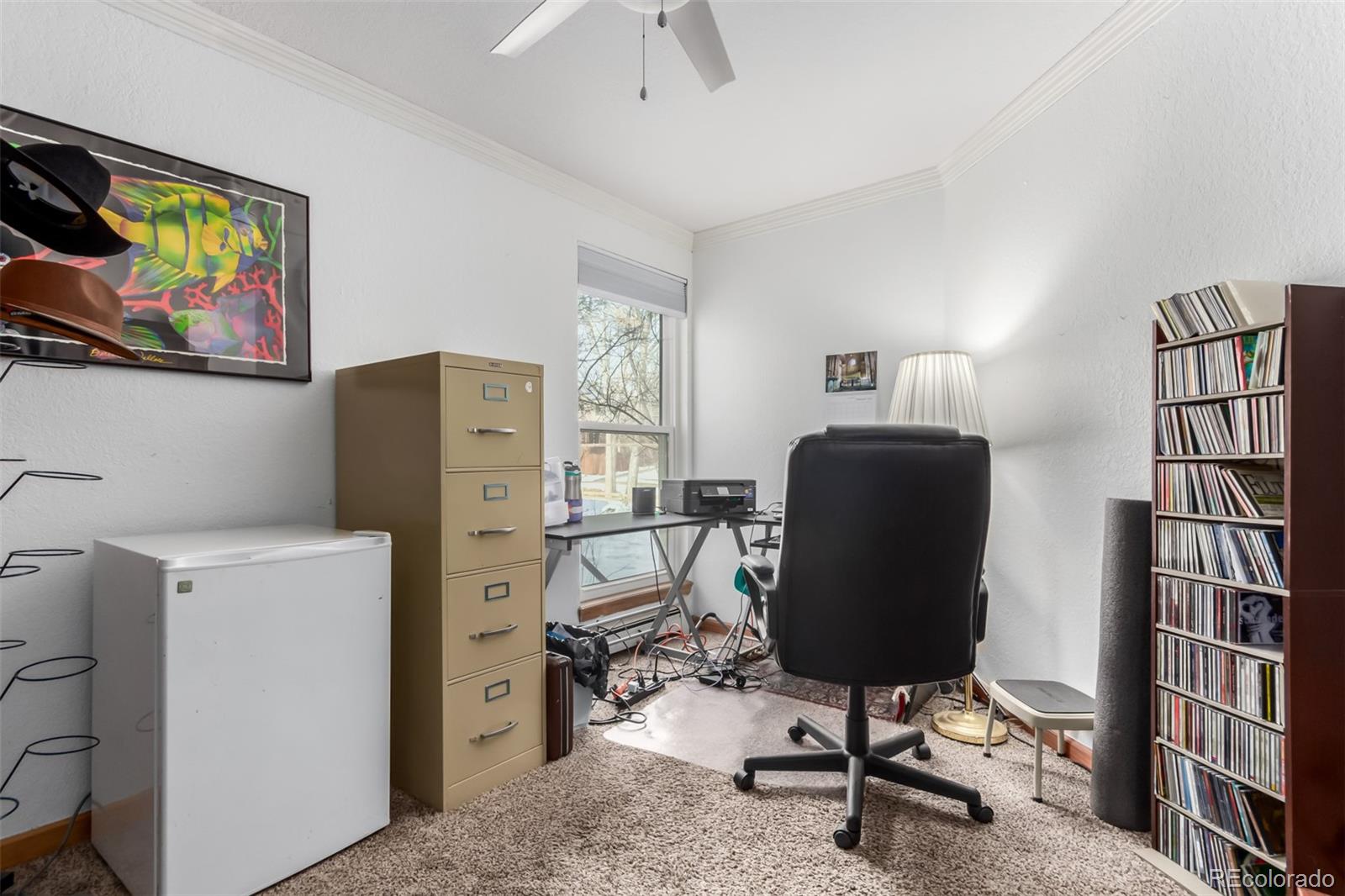 4855 Edison Avenue, Unit 112 Boulder, CO 80301 - Photo 10 of 20 a view of a workspace with furniture and a window