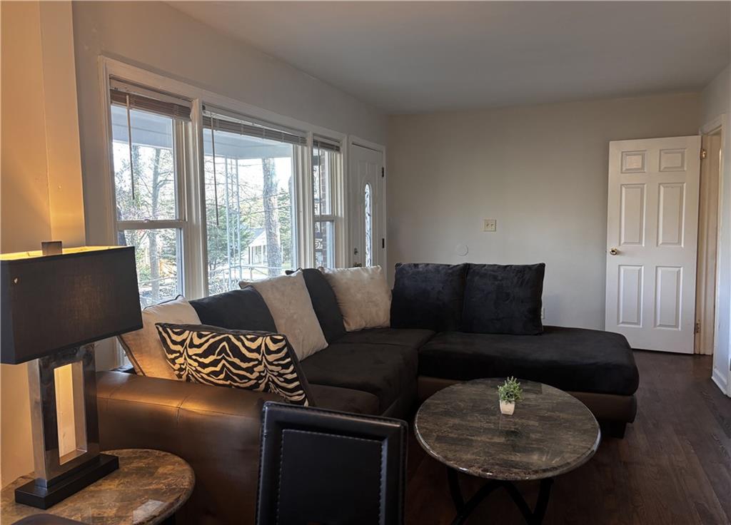 269 Florida Avenue Southwest Atlanta, GA 30310 - Photo 2 of 11 a living room with furniture and a lamp