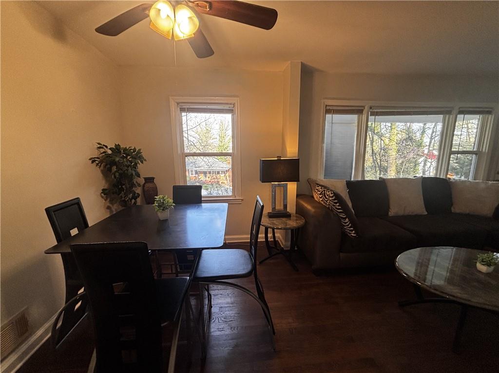 269 Florida Avenue Southwest Atlanta, GA 30310 - Photo 5 of 11 a view of a dining room with furniture and wooden floor