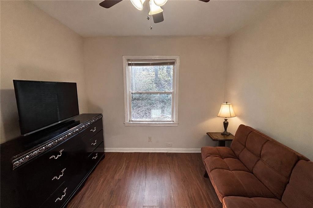 269 Florida Avenue Southwest Atlanta, GA 30310 - Photo 10 of 11 a living room with furniture and a flat screen tv