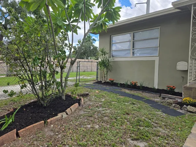 a backyard of a house with lots of green space