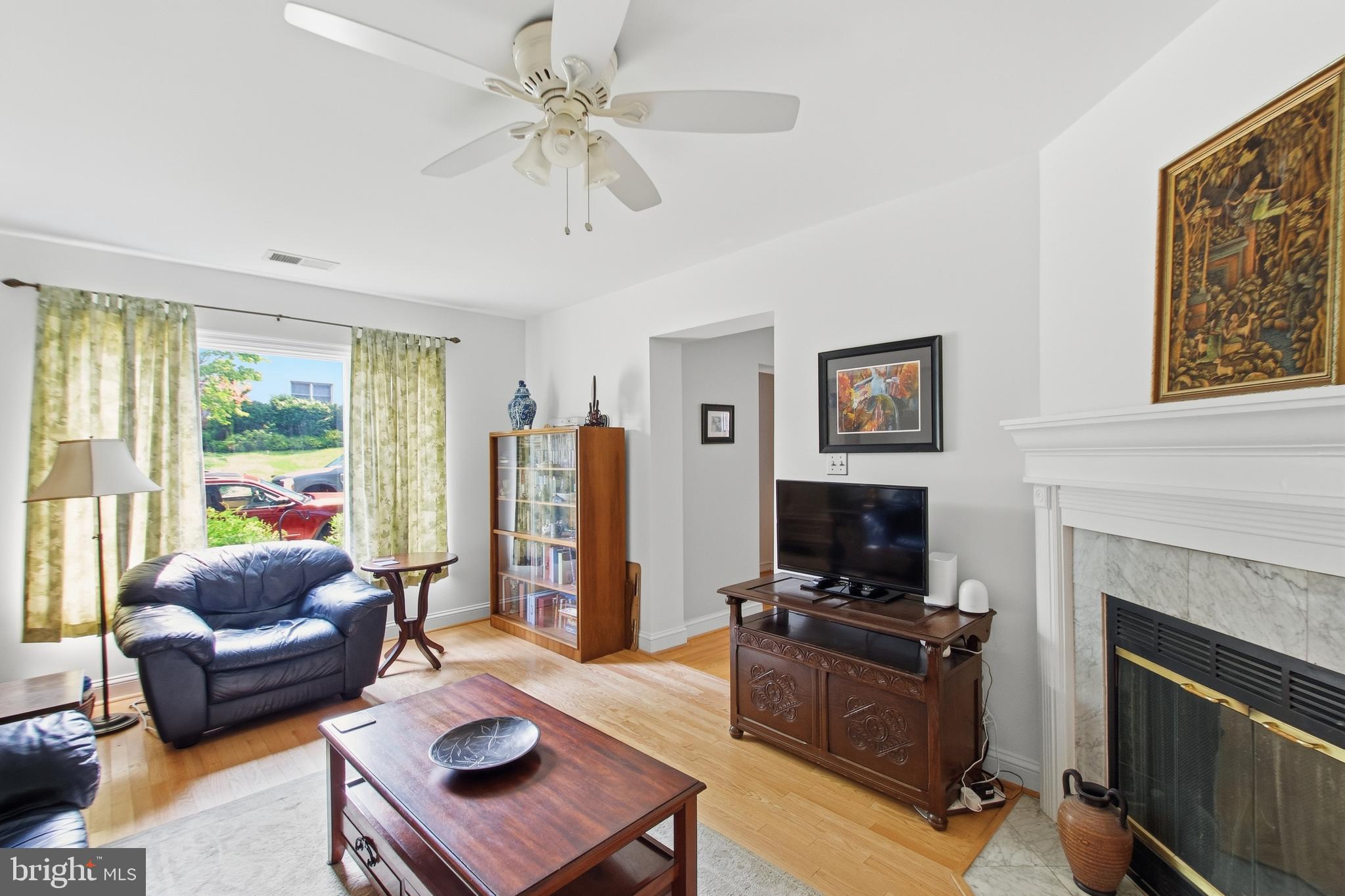 215 West George Mason Road Falls Church, VA 22046 - Photo 19 of 50 a living room with furniture and a fireplace