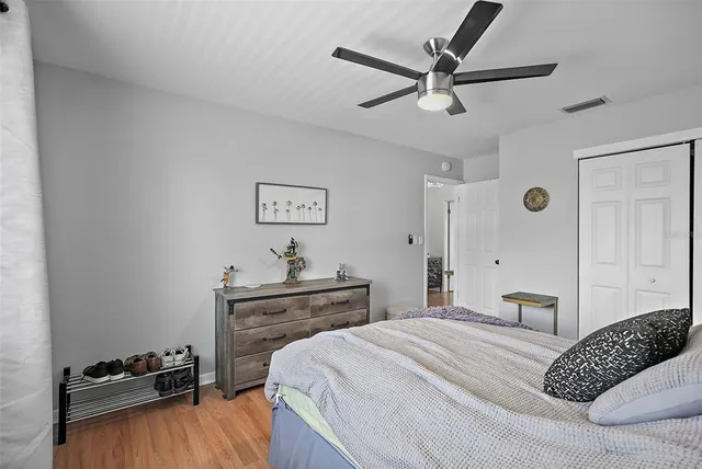 a bedroom with a bed and a dresser