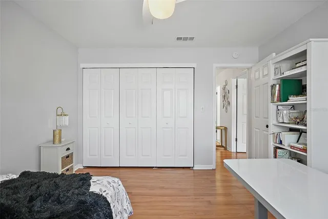 a bedroom with a bed and a cabinets