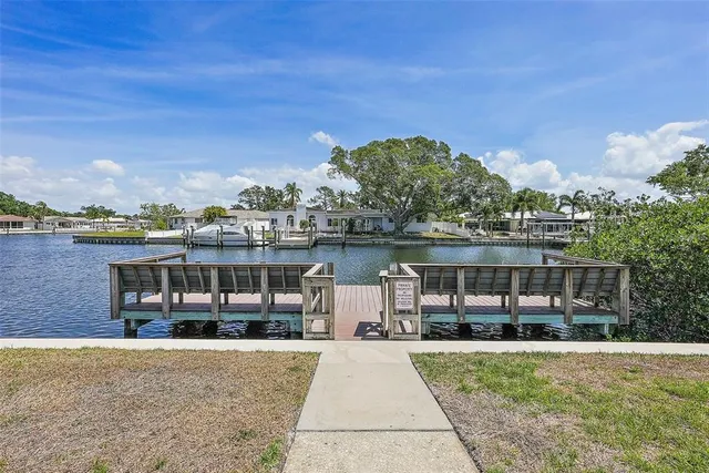 a view of a patio with a lake view