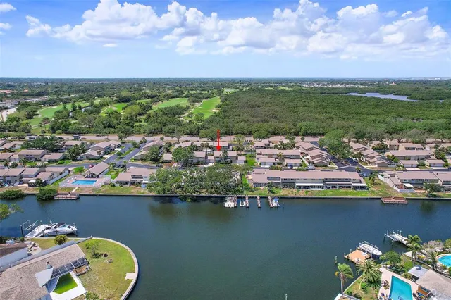 an aerial view of a house with a lake view