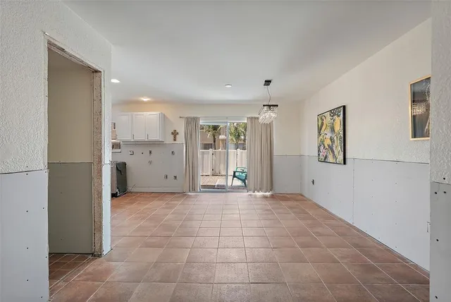 a view of a big room with a windows and cabinet