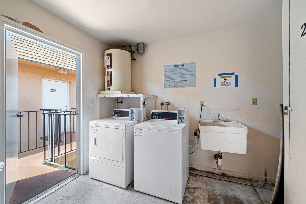 600 Southwest 2nd Street, Unit 2390 Boca Raton, FL 33486 - Photo 17 of 18 a room with dryer and washer