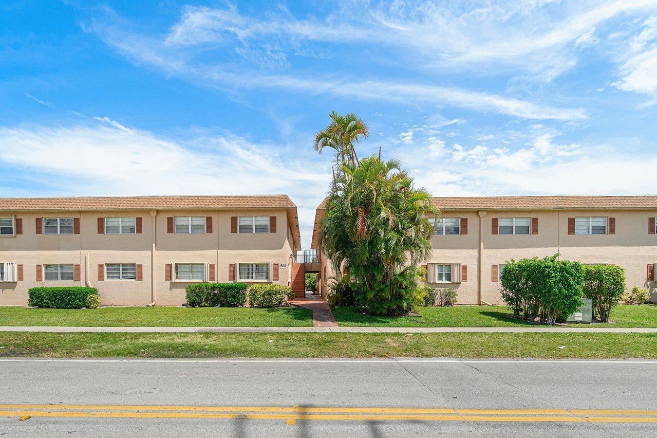 600 Southwest 2nd Street, Unit 2390 Boca Raton, FL 33486 - Photo 3 of 18 a front view of a house with a yard