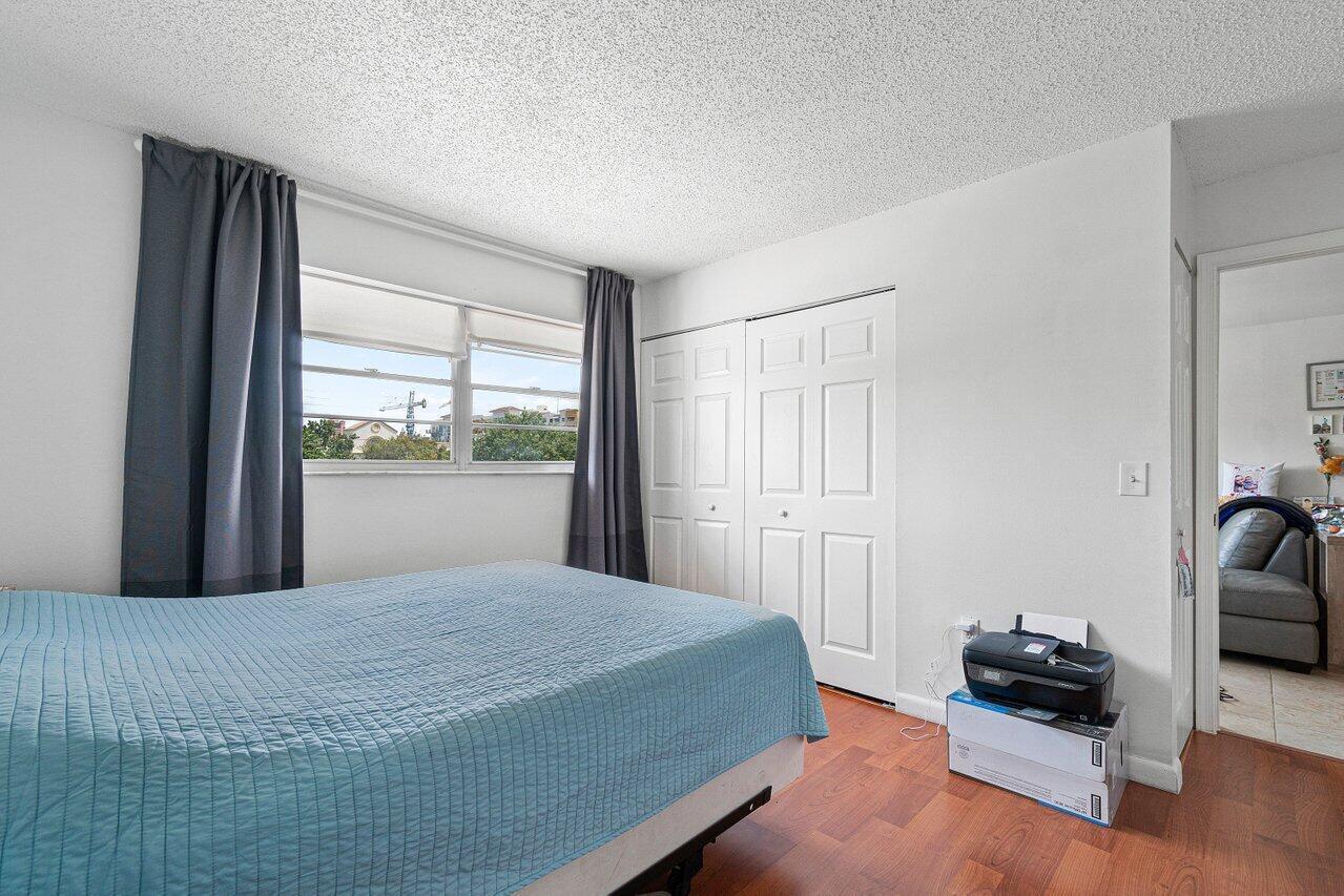 600 Southwest 2nd Street, Unit 2390 Boca Raton, FL 33486 - Photo 10 of 18 a bedroom with a bed and a window