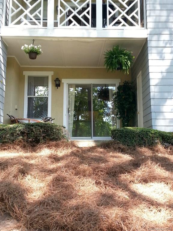 20119 Henderson Road, Unit A Cornelius, NC 28031 - Photo 2 of 13 front view of a house with a yard