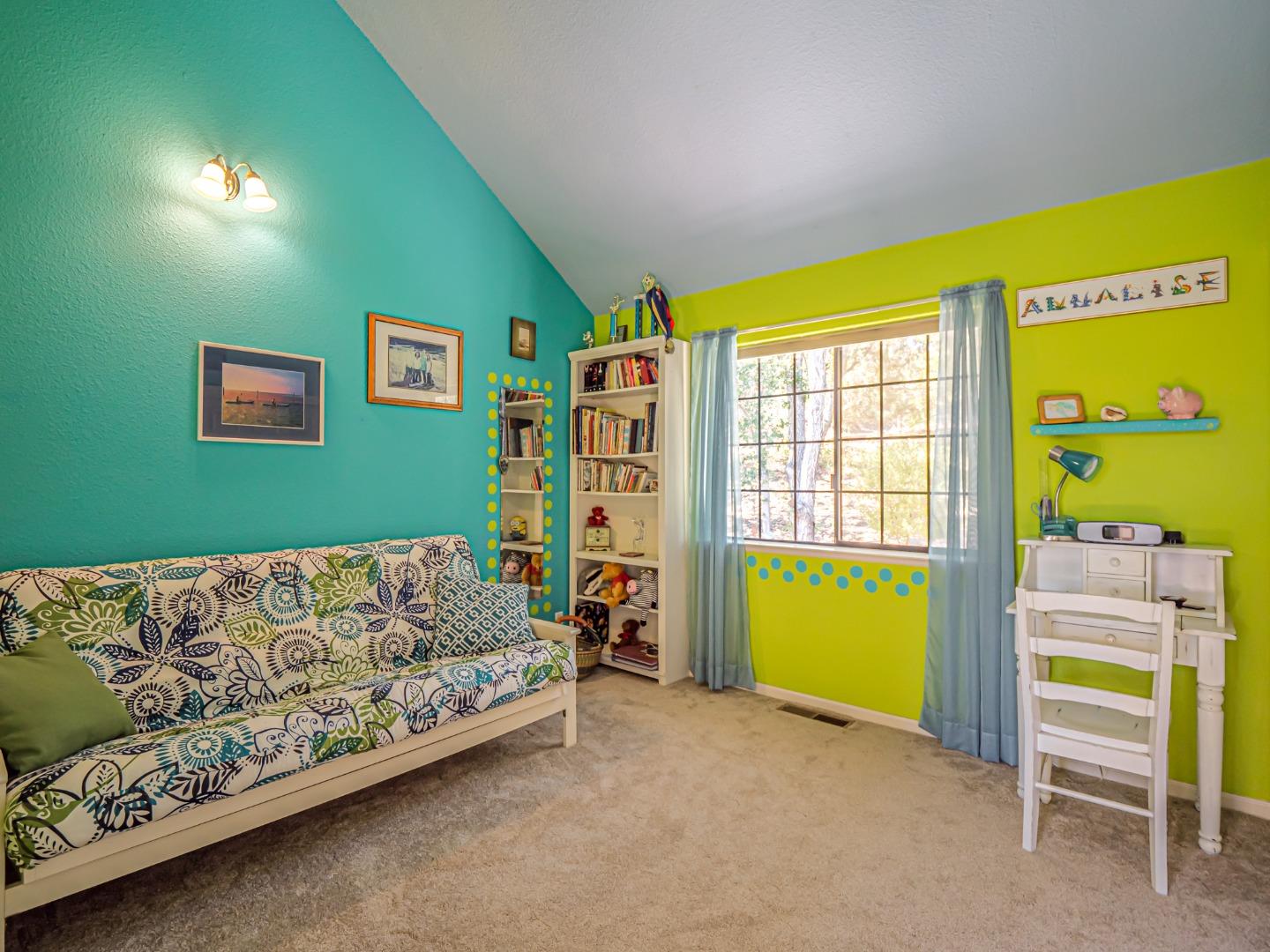 394 Hames Road Corralitos, CA 95076 - Photo 22 of 39 a bed room with a bed and a chair