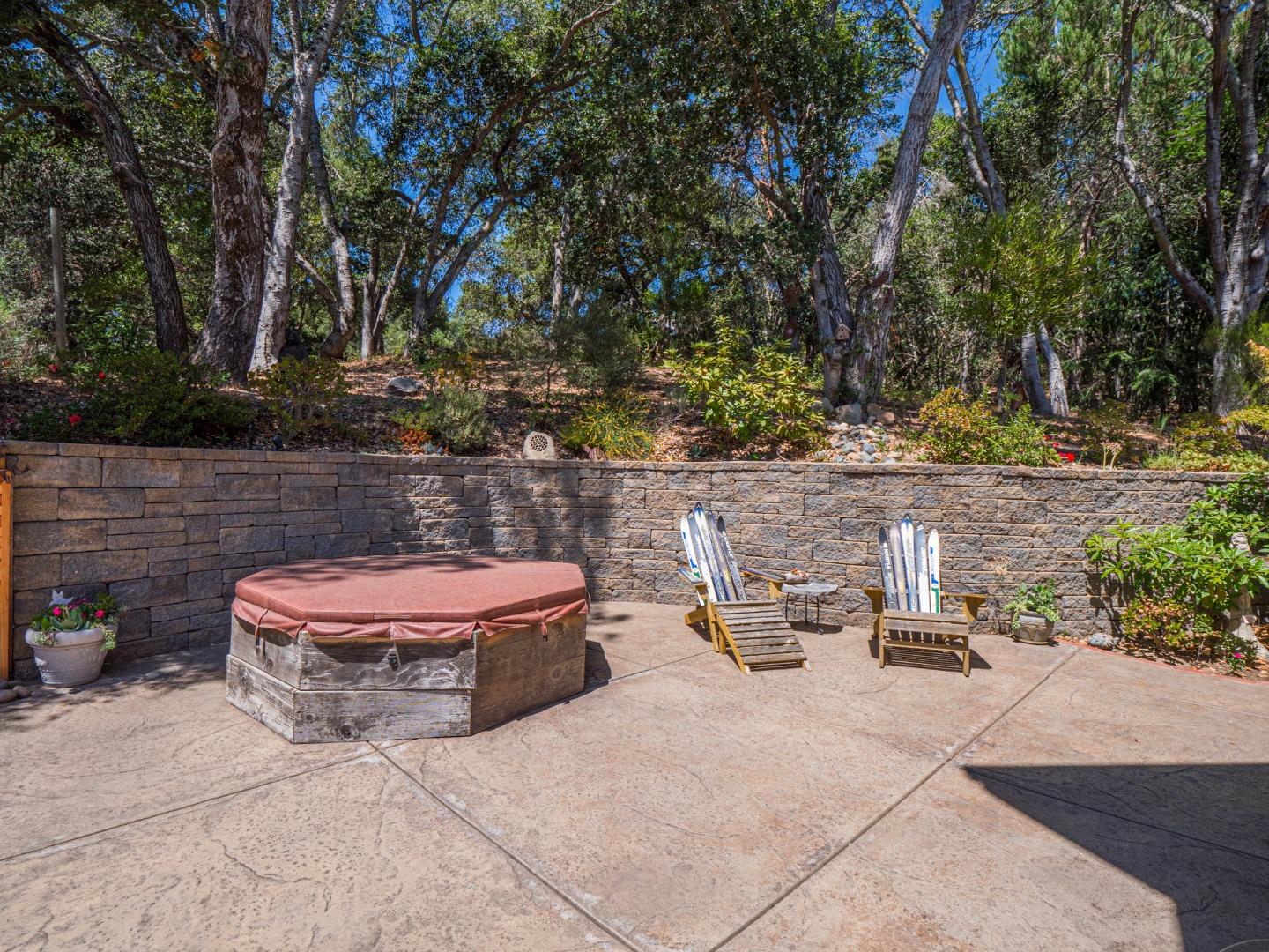 394 Hames Road Corralitos, CA 95076 - Photo 39 of 39 a view of a patio with table and chairs potted plants and large tree