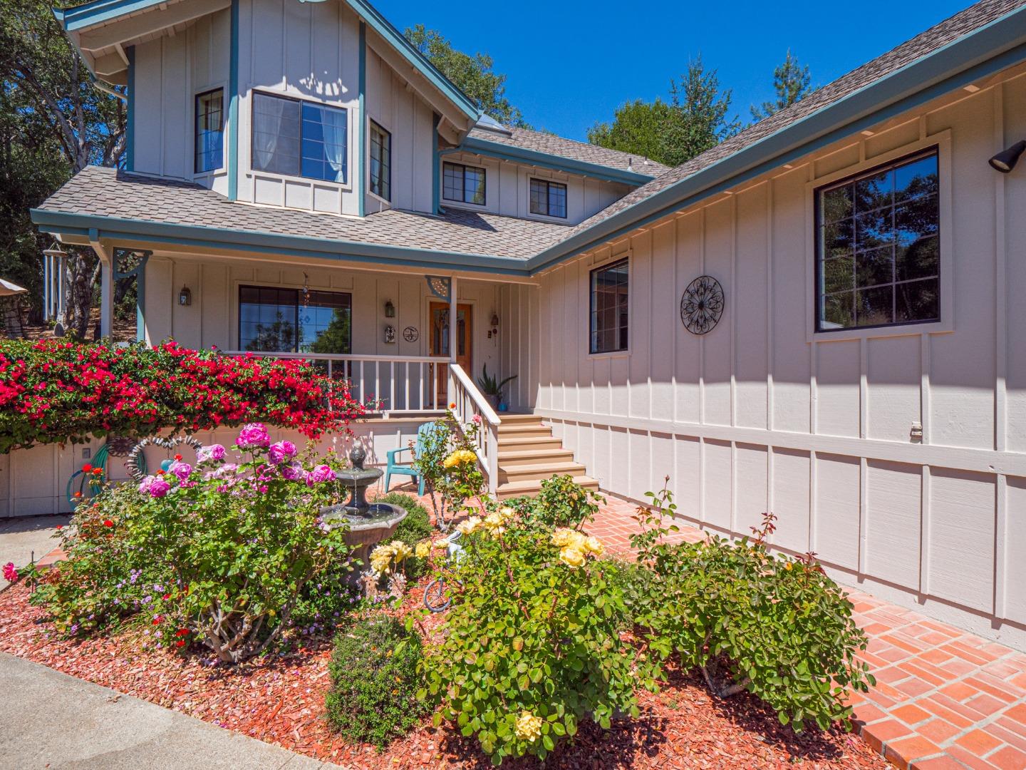 394 Hames Road Corralitos, CA 95076 - Photo 5 of 39 a front view of a house with a yard