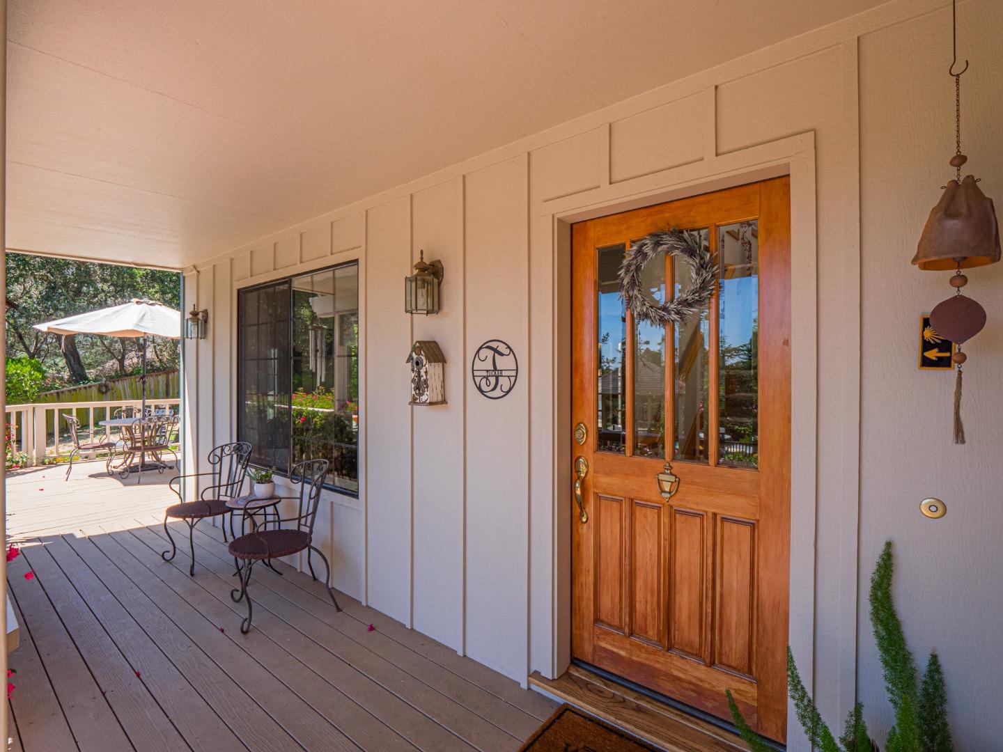 394 Hames Road Corralitos, CA 95076 - Photo 7 of 39 a view of a hallway with wooden floor and dining room view