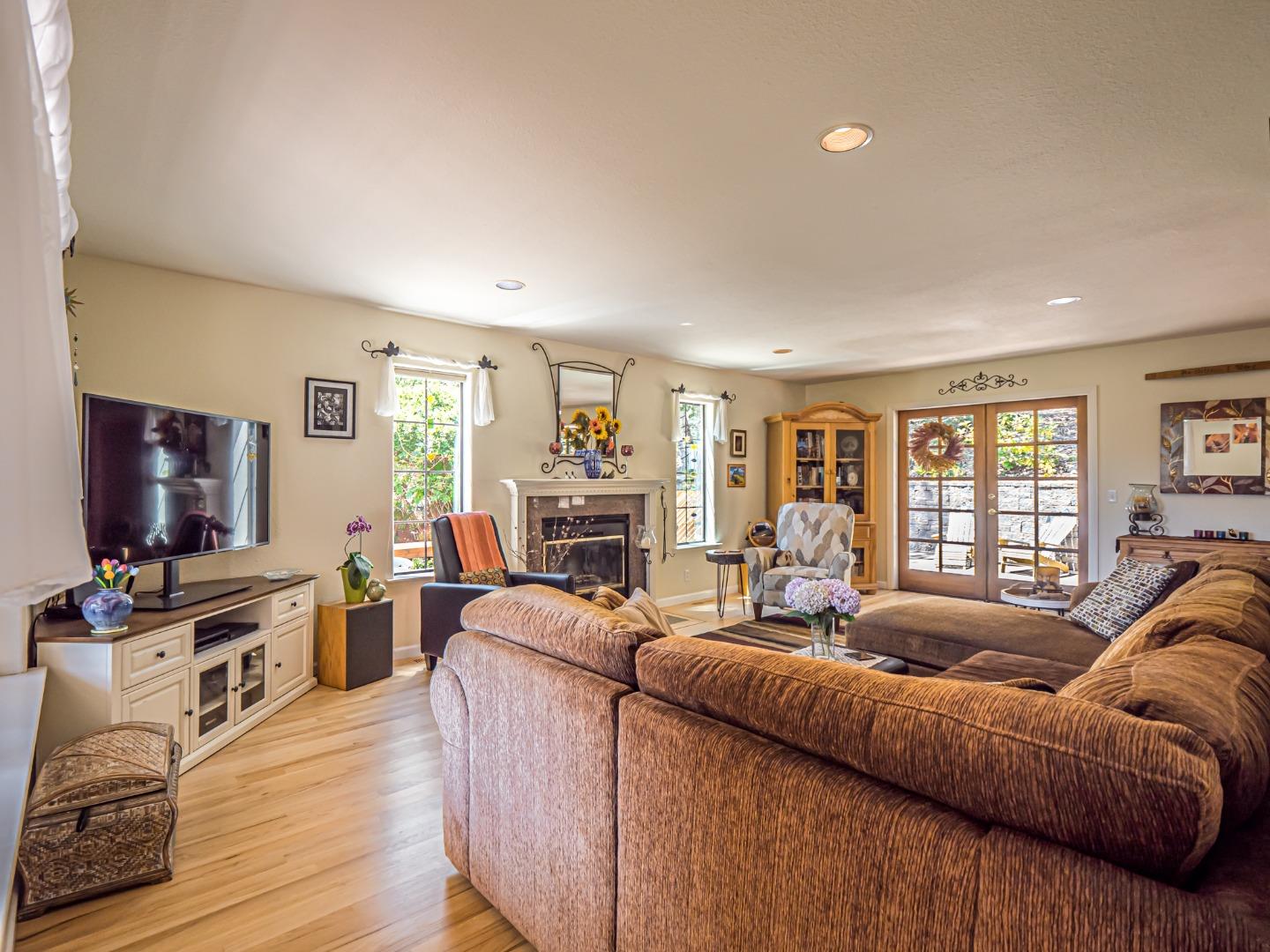 394 Hames Road Corralitos, CA 95076 - Photo 8 of 39 a living room with furniture and a flat screen tv