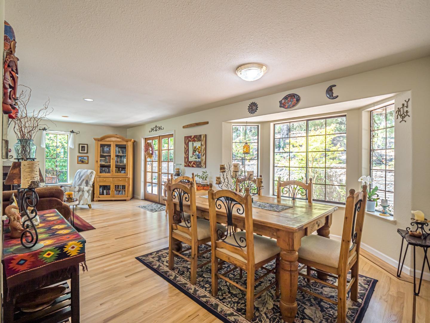394 Hames Road Corralitos, CA 95076 - Photo 10 of 39 a living room with furniture and wooden floor