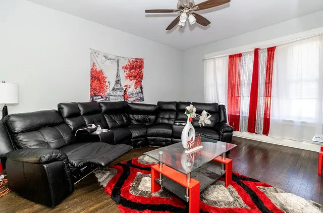 a living room with furniture and a window